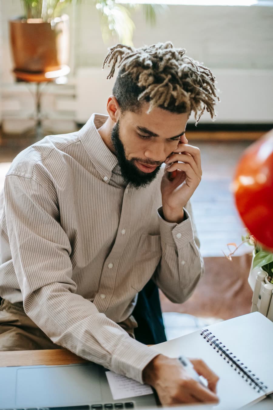 Team member on a call reviewing notes to qualify a lead